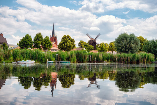 View to shore of Werder, Havel, with Holy Spirit Church -Heilig Geist Kirche- and Bock Windmill -Bockwindm&uuml;hle- , Potsdam, Germany