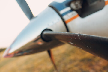 Small private single engine propeller airplane with fly on blade at regional airport.