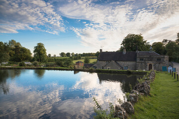 Dramatic sky over the village pond in Tissington, Derbyshire, UK