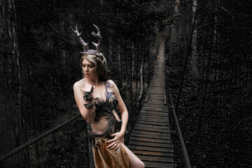 horny devil queen walk on hanging bridge.Wild witch vampire creativ. Seductive luxury slim naked...