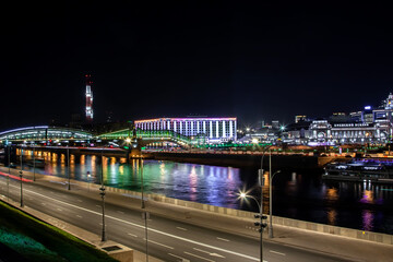 Beautiful embankment of the river at night in the city. Moscow, Russian Federation, 08.08.2020