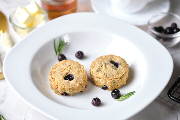 Blueberry scones. a Traditional British baked good for tea time. set on cafe table.