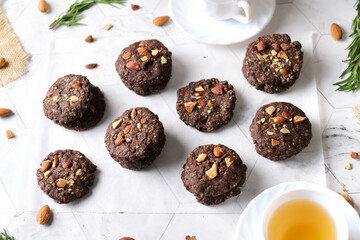 Vegan Almond oatmeal chocolate cookies set in cafe table.