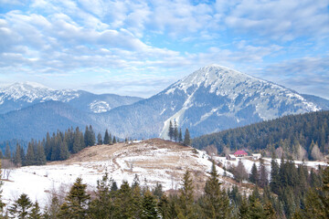 Early spring mountain landscape, melting snow, view of mountain Homyak.