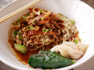 Close up of roasted duck over egg noodles ready to be served