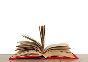 Open book textbook in a red cover on a wooden desk with white background. Back to school distance home education.Quarantine concept of stay home.