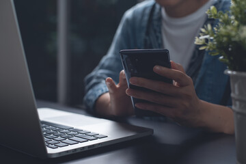 Business woman typing on laptop computer
