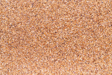 Sea sand as background, space for text.