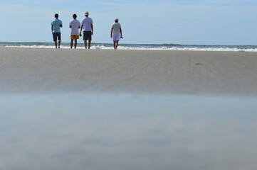 family walking on the beach