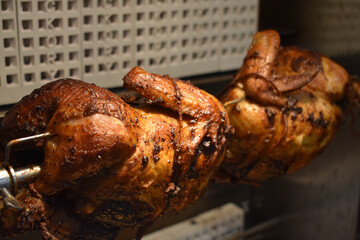 Fresh Cooked Rotisserie Chicken Still Inside the Rotisserie
