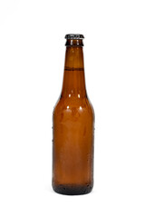 A brown beer bottle centered in the image with a white background.