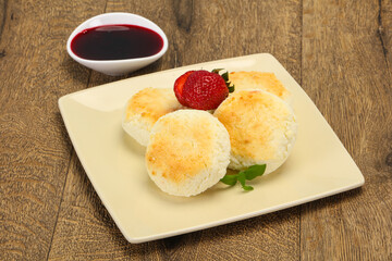 Curd pancakes with jam and stravberry