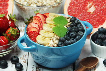 Healthy diet breakfast including cereal with berry and fruits