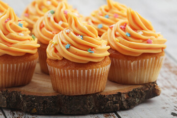 Cupcakes with orange icing on top