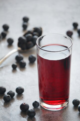 A glass full of blueberry juice