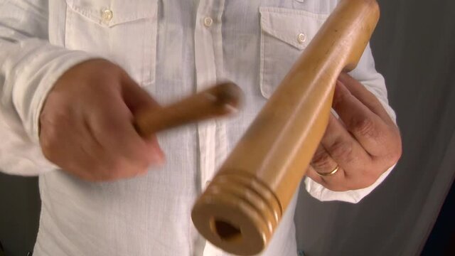 4k 50fps Percussionist plays a Cuban claves with a wooden mallet