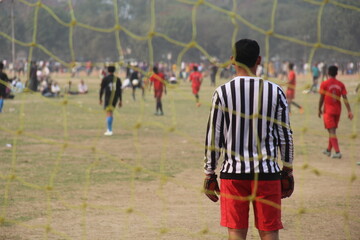football match through the veiw of a goalkeeper