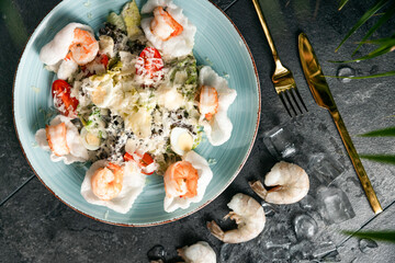 Healthy salad plate. Fresh seafood recipe. Grilled shrimps and fresh vegetable salad and egg. Grilled prawns. Healthy food. Flat lay. Top view