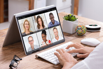Businesswoman Video Conferencing With His Colleagues On Laptop