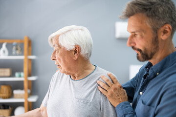 Old Senior Man With Dementia Getting Support And Care