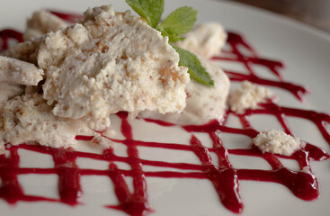 yummy milky sweet dessert with red strawberry jam 