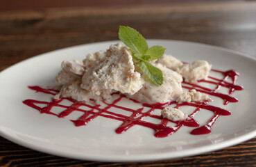 yummy milky sweet dessert with red strawberry jam 