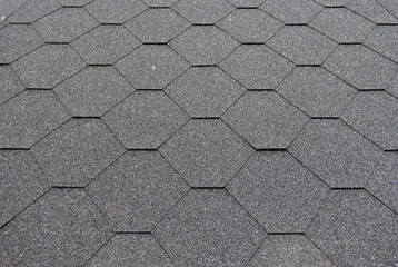 Close Up of Patterned Asphalt Roofing with Dark Grey Texture 