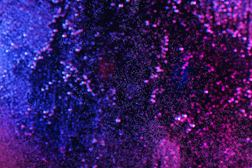 Close-up of abstract ink underwater. Paint flows under water background.