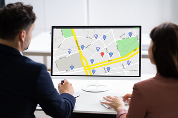 Business People Looking At Online GPS Map