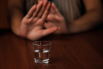 Young woman alcoholic social problems concept sitting refusal of alcohol