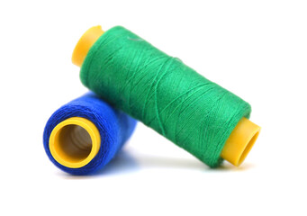 Spool of coloured thread isolated on white background. 