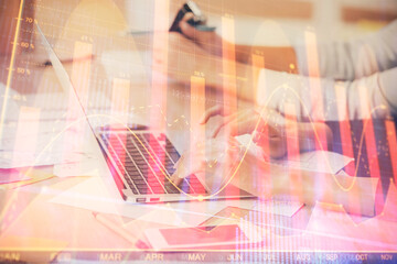 Multi exposure of woman hands typing on computer and financial chart hologram drawing. Stock market analysis concept.