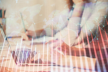 Multi exposure of woman hands typing on computer and financial chart hologram drawing. Stock market analysis concept.