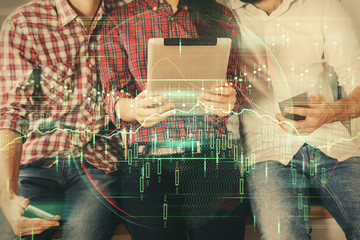 Double exposure of forex graph drawing and man and woman working together holding and using a mobile device. Trade concept.