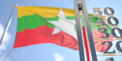 Thermometer shows high air temperature against blurred flag of Myanmar. Hot weather forecast related 3D rendering