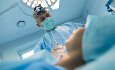 Man surgeon at work in operating room
