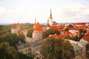 Naklejka na ściany i meble Panoramic view of the central streets of Tallinn on a summer morning in Estonia. Real grain scanned film.