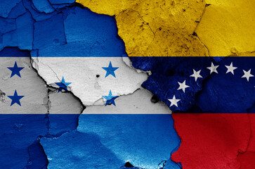 flags of Honduras and Venezuela painted on cracked wall