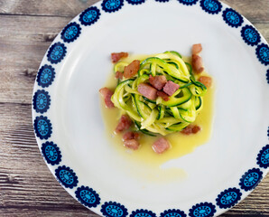 Zucchini alla carbonara. A twist on the traditional Italian carbonara using zucchini noodles instead of spaghetti and omitting the cream for a gluten free, low carb version of the dish
