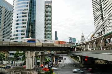 BTS sky train runs through the station. View of Bangkok skyline and skyscraper with BTS skytrain.
