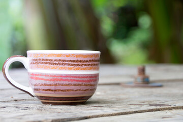 One cup of coffee, in  a garden