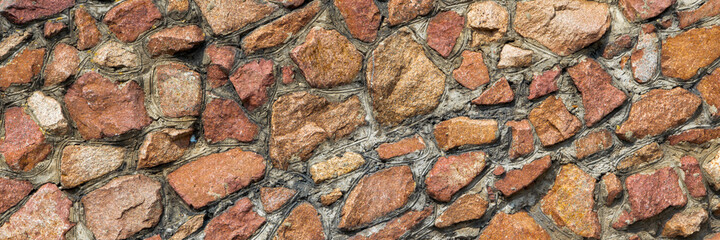 colorful wall made of natural stone, close