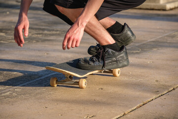 Close up of skateboard rider footwork
Youth practicing kick flips displays footwork when landing on...