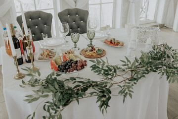 beautifully laid tables with glasses and appliances at morning in restaurant