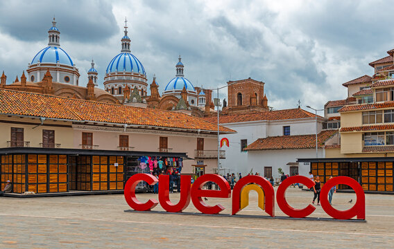Cityscape with symbol sign of Cuenca city on San Francisco square with the famous domes of the New Cathedral in the background, Cuenca, Ecuador.