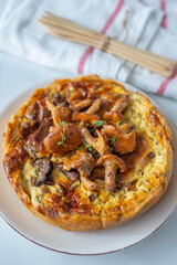 Home made quiche with chanterelles on a table