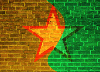 Colored brick background with graphic elements and inscriptions, close-up.