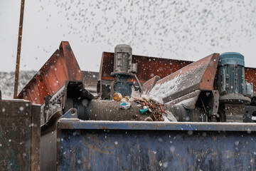 Moving conveyor transporter on Modern waste recycling processing plant. Separate and sorting garbage collection. Recycling and storage of waste for further disposal.