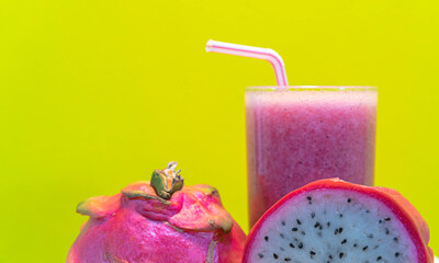 Pitaya juice and fresh fruits on yellow background