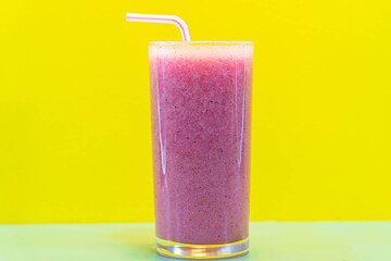 Pitaya juice and fresh fruits on yellow background